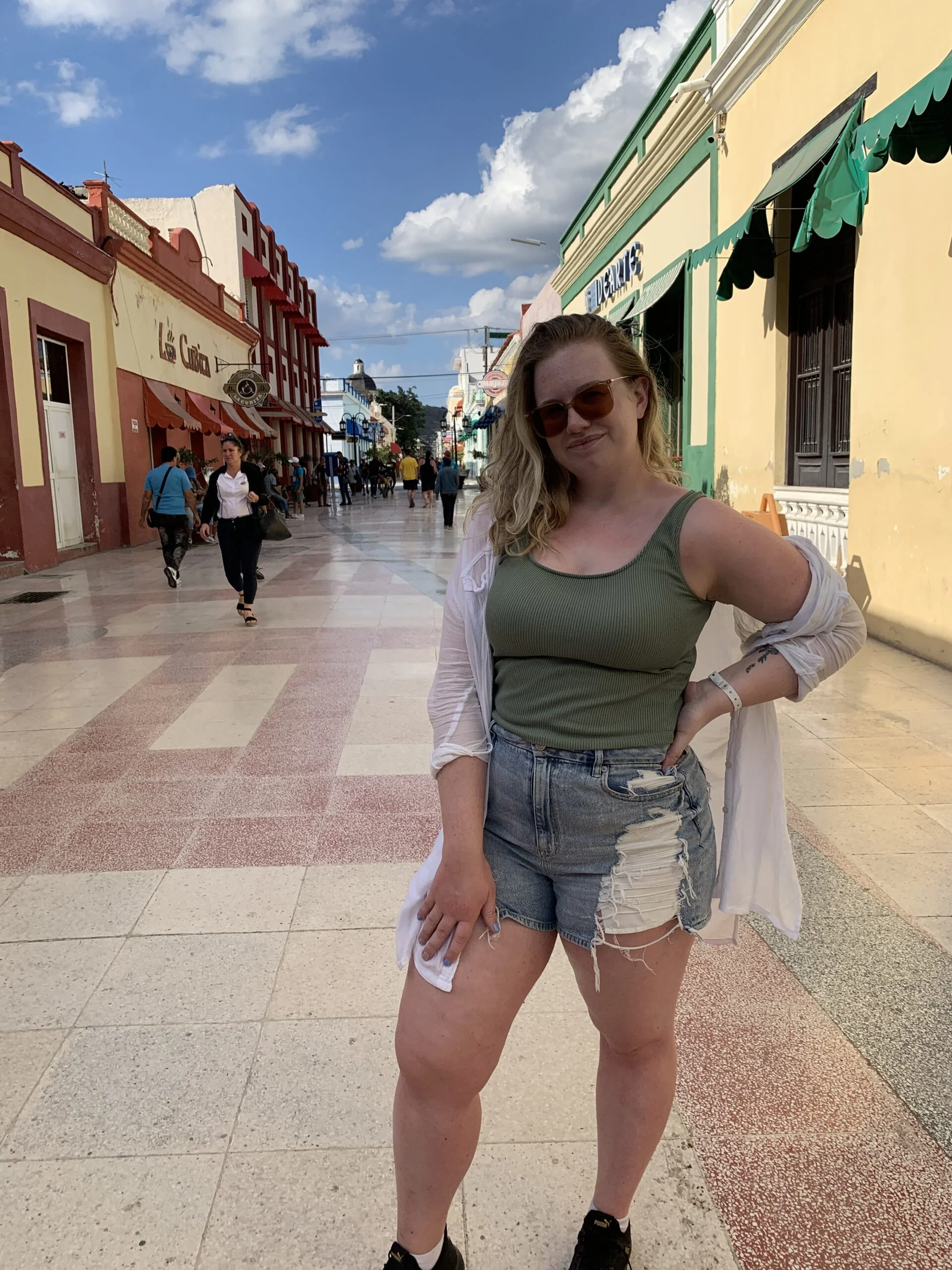 Downtown Holguin, What to wear in cuba for a day trip: wearing shorts, a top and flowy button up