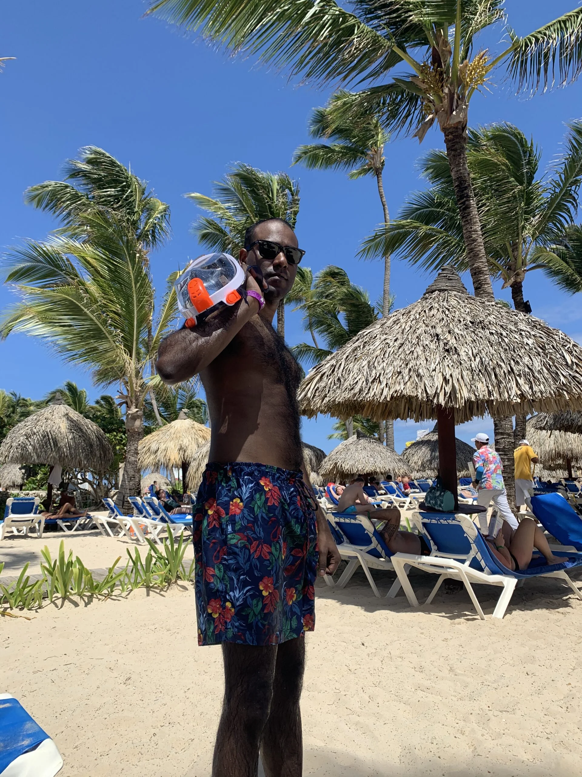 Hanging on the beach with swim trunks and snorkel goggles