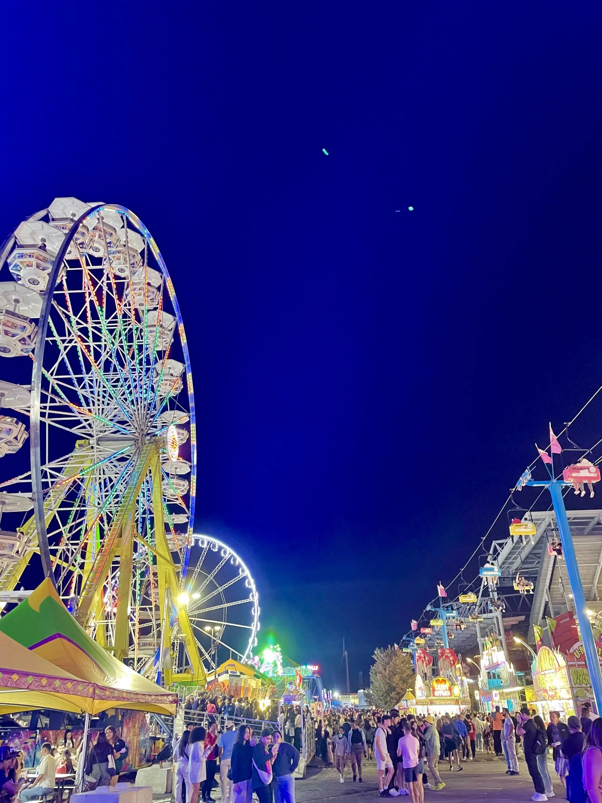 CNE at night, ferris wheels lit up