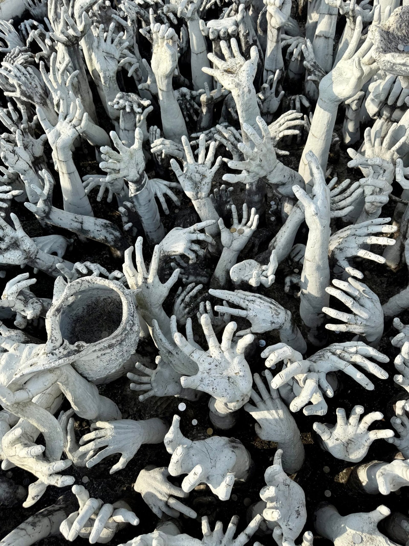 White hands at white temple, Chiang Rai