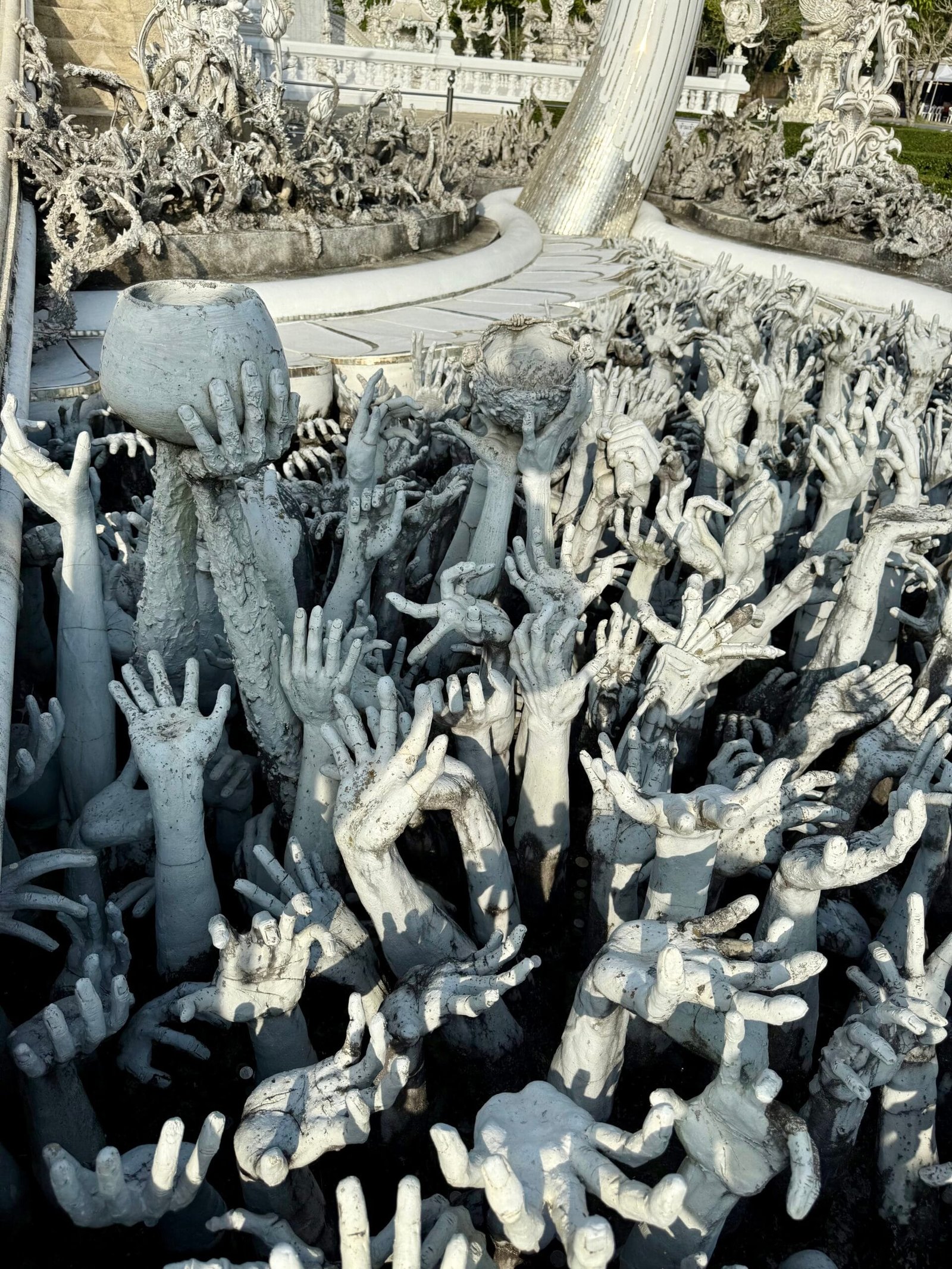 white hands at white temple, chiang rai